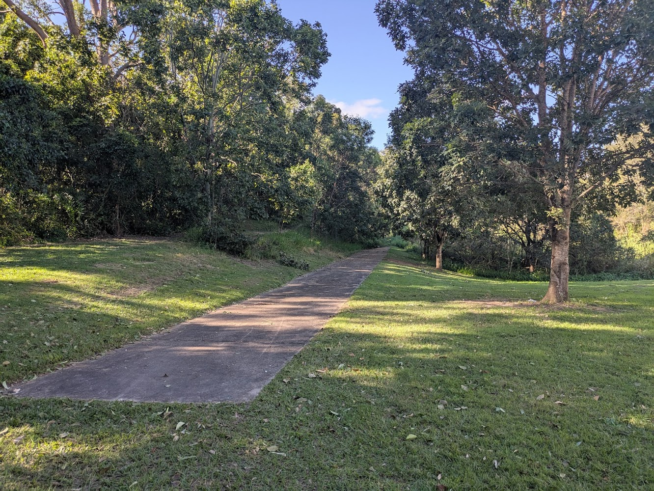 A concrete path that can be seen to suddenly end and turn to grass.