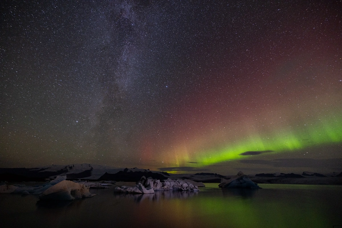 Aurora and Milky Way at Diamond Beach in Iceland