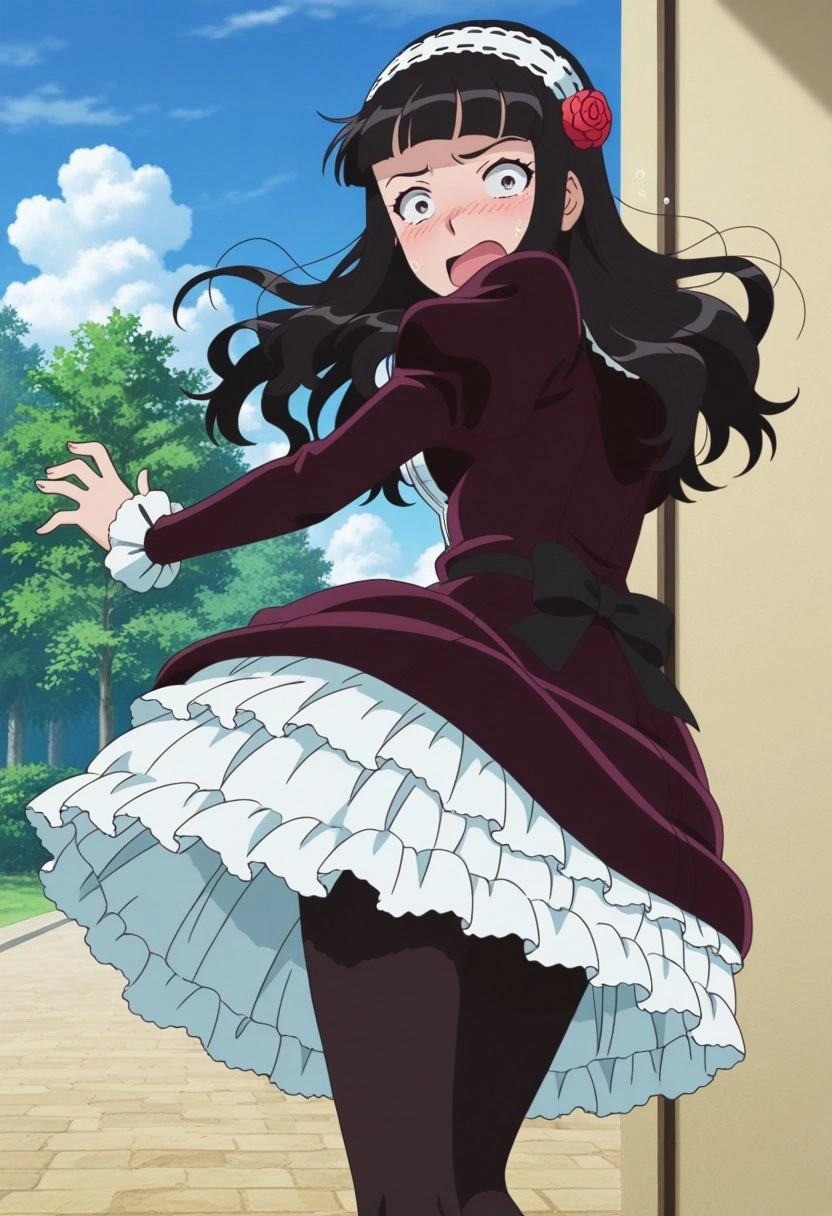 A young woman with dark eyes, long black hair, and a shocked, panicked expression mid-motion pose, turning around quickly as if startled. She is wearing a dark maroon, long-sleeved dress with a large, multi-layered, white ruffled petticoat, black tights, and a white ruffled headband with a red rose in her hair. The setting is an outdoor paved pathway next to a building, with a background of green trees under a blue sky with white clouds.