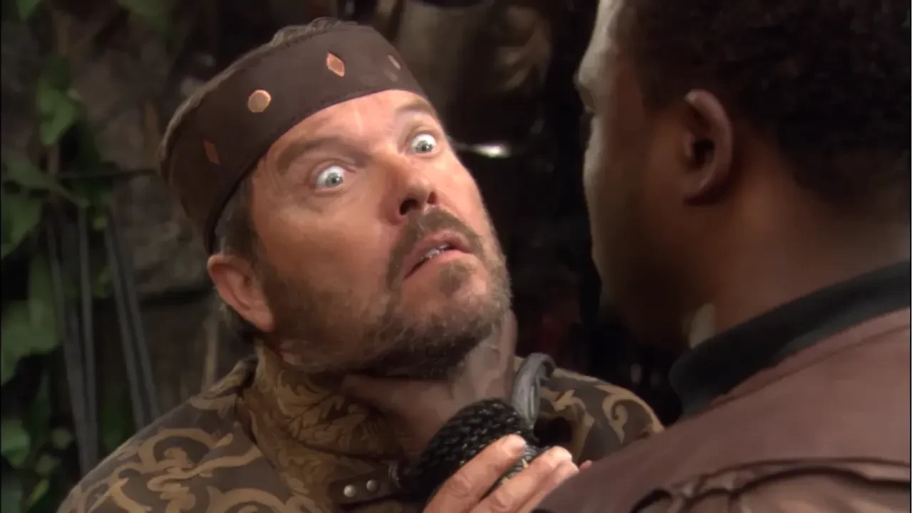 Photo of Maybourne being choked by first prime Wayne Brady