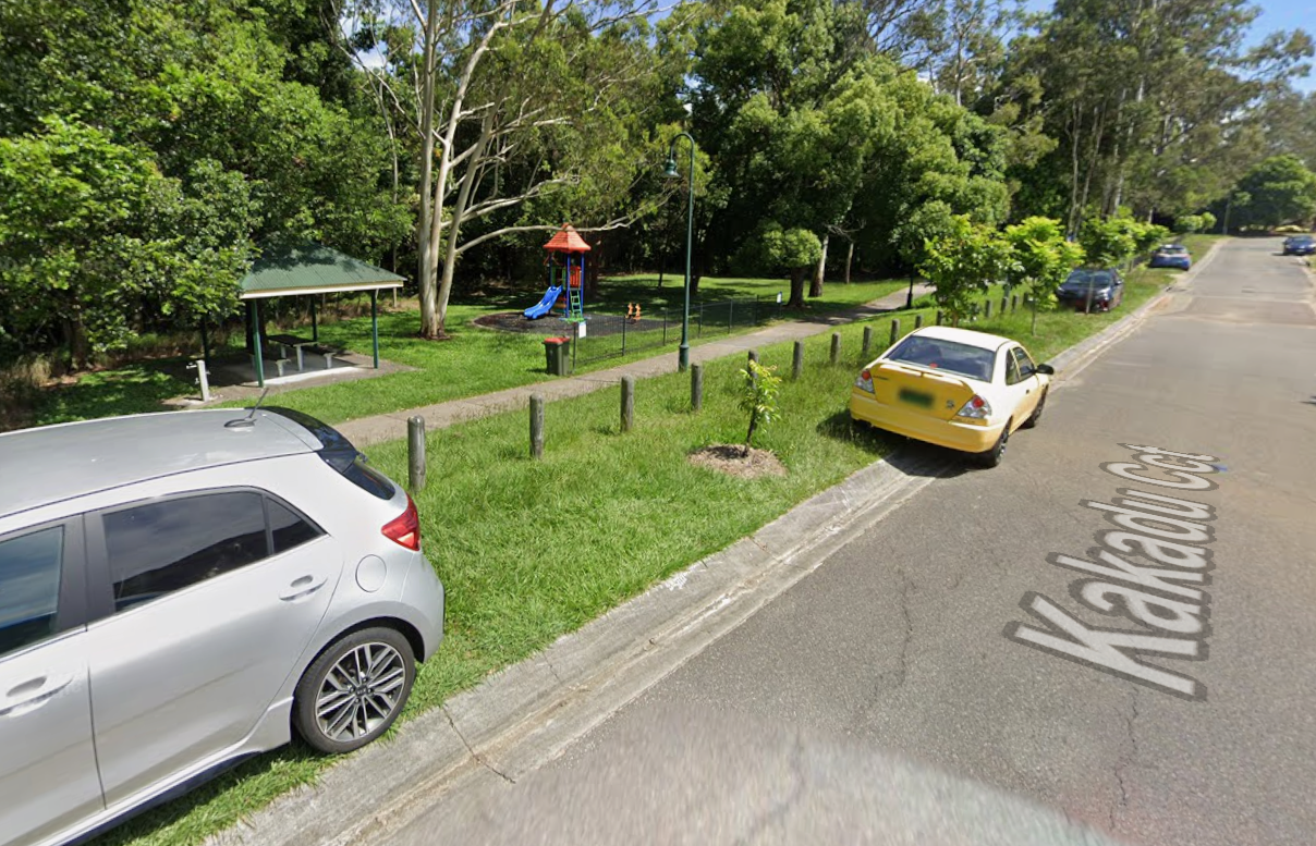Image showing a footpath between the road and a playground